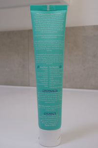 Back of a Flossy & Pure Mild Mint toothpaste tube showing the directions for use