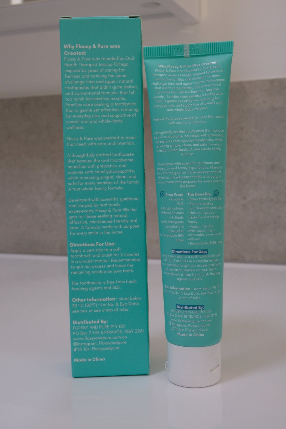 Back of the Flossy & Pure toothpaste carton and tube, showing the directions and product information