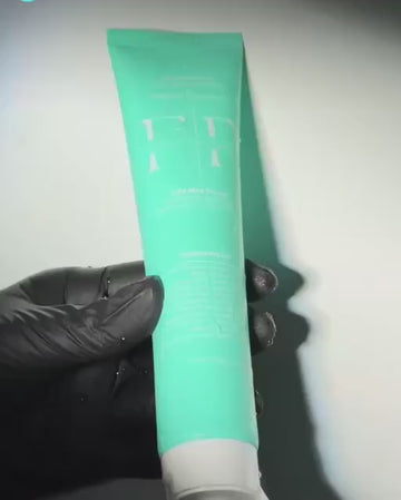 Real Flossy & Pure toothpaste squeezed onto a toothbrush in the clinic